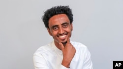 Freelance video journalist Amir Aman Kiyaro, who is accredited to The Associated Press, is pictured in Ethiopia, Oct. 17, 2021. Kiyaro marked 100 days in detention without charge in March 2022.