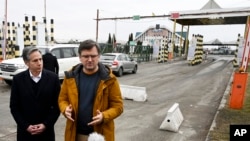 US Secretary of State Antony Blinken, left, and Ukrainian Foreign Minister Dmytro Kuleba speak to the media after meeting at the Ukrainian-Polish border crossing in Korczowa, Poland, March 5, 2022.