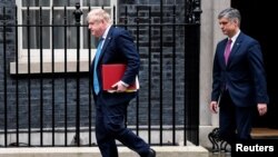 British Prime Minister Boris Johnson leaves 10 Downing Street with Ukraine's Ambassador to the United Kingdom Vadym Prystaiko ahead of Johnson attending Prime Minister's Questions in London, Britain March 2, 2022.