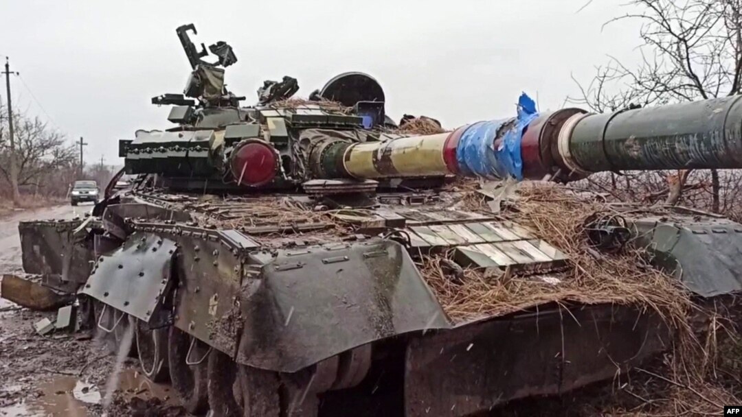 This screen grab from a handout video released by the Russian Defense Ministry on March 4, 2022, shows a destroyed Ukrainian army tank in the settlement of Gnutovo outside Mariupol.