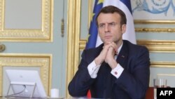 File photo taken on March 19, 2020 French president Emmanuel Macron, takes part on a videoconference of the "economic task force",