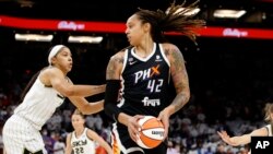 FILE: Phoenix Mercury center Brittney Griner (42) plays in the WNBA finals, Oct. 10, 2021, in Phoenix.