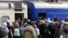 Passengers, including people fleeing Russia's invasion of Ukraine, board a train as they leave the city of Odessa, Ukraine, March 4, 2022. 