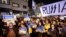 People protest against the Russian invasion of Ukraine, outside the Russian Embassy in Tel Aviv, March 5, 2022.