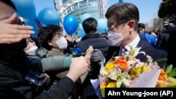 Lee Jae-myung, the presidential candidate of the ruling Democratic Party, is greeted by supporters during a presidential election campaign in Seoul, South Korea on March 3, 2022. 