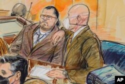 This artist sketch depicts Guy Wesley Reffitt, a Texas man charged with storming the U.S. Capitol with a holstered handgun on his waist who is the first Jan. 6 defendant to go on trial, in Washington, Feb. 28, 2022.