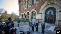 Anton Korynevych, Permanent Representative of the President of Ukraine in the Autonomous Republic of Crimea, and Oksana Zolotaryova, director, International Law Department, Ministry of Foreign Affairs of Ukraine, speak outside the International Criminal Court in The Hague, Netherlands, March 7, 2022.