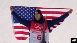 Gold medal winner United States' Alexander Hall celebrates after winning the men's slopestyle at the 2022 Winter Olympics, Feb. 16, 2022, in Zhangjiakou, China.