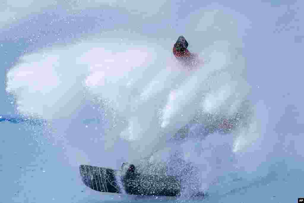 Niek van der Velden of the Netherlands crashes as he lads during the men&#39;s snowboard big air finals of the 2022 Winter Olympics in Beijing.