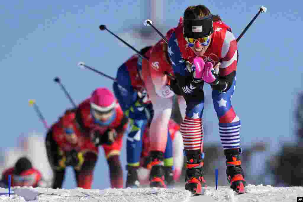 Rosie Brennan of the U.S. leads a group during the women&#39;s team sprint classic cross-country skiing competition at the 2022 Winter Olympics in Zhangjiakou, China.