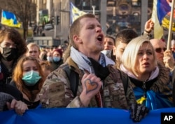 Ukrainians rally against a potential Russian invasion of Ukraine, in central Kyiv, Feb. 12, 2022.