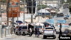 FILE - Somali security forces secure the road leading to the scene of an explosion at a checkpoint near the Presidential palace in Mogadishu, Somalia, Feb. 10, 2022. 