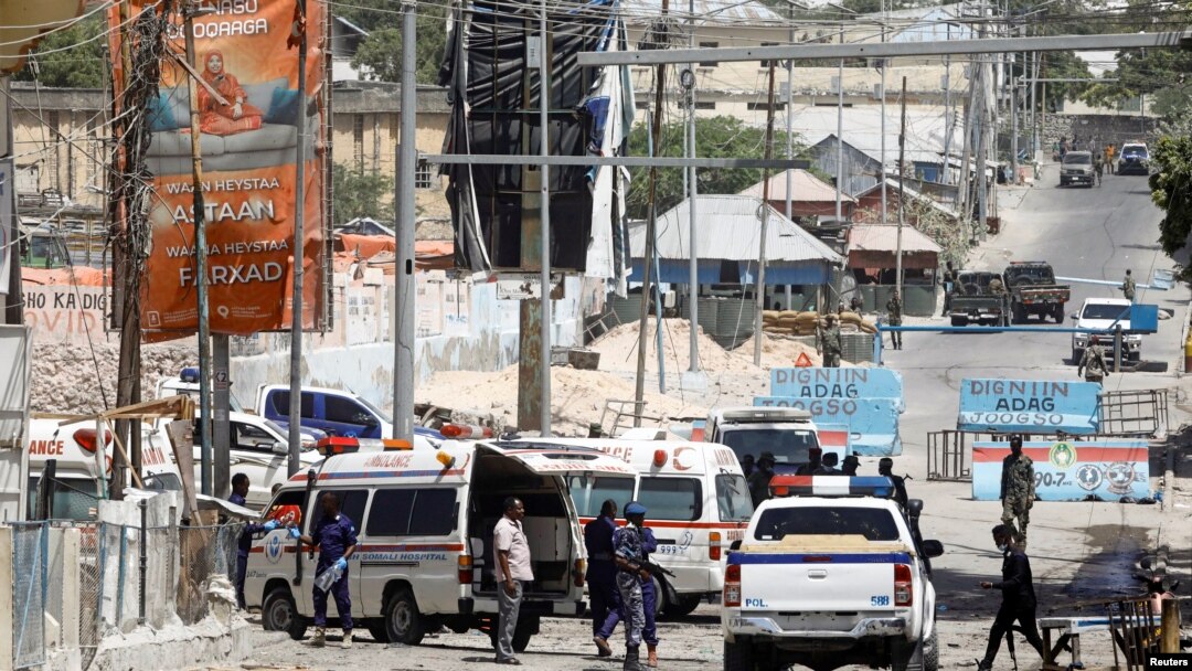 FILE - On Feb. 10,2022, Somali security forces secure the road leading to the scene of an explosion at a checkpoint near the presidential palace in Mogadishu, Somalia. A roadside bomb injured four people in the city on March 17, 2022.