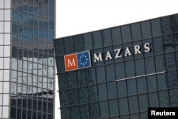 FILE - The logo of Mazars is seen on a building in the financial district of la Defense near Paris, France, May 14, 2018.