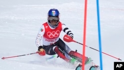 Mialitiana Clerc, of Madagascar passes a gate during the second run of the women's slalom at the 2022 Winter Olympics, Feb. 9, 2022, in the Yanqing district of Beijing.