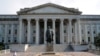 FILE PHOTO: A man walks away from the U.S Treasury Department in Washington.