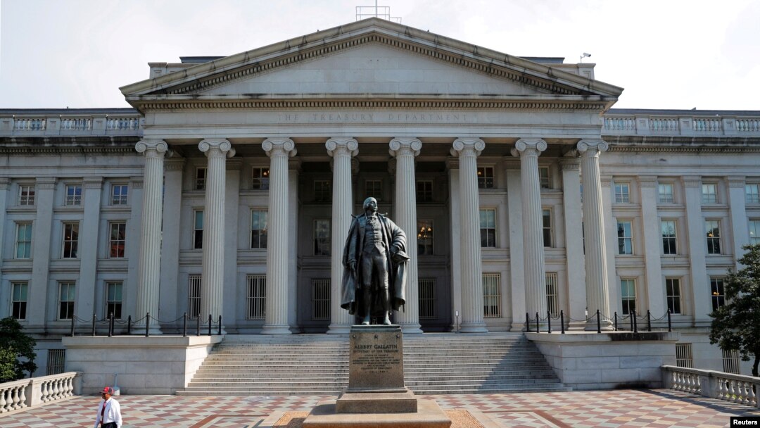 FILE PHOTO: A man walks away from the U.S Treasury Department in Washington.