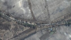 This Maxar satellite image taken and released Feb. 28, 2022, shows the southern end of a Russian military vehicle convoy on T-1011 highway east of Antonov Airport near Kyiv, Ukraine.