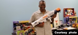 Lonnie Johnson carries the Super Soaker water gun toy, which he invented. (Courtesy of Johnson Research & Development Co., Inc)