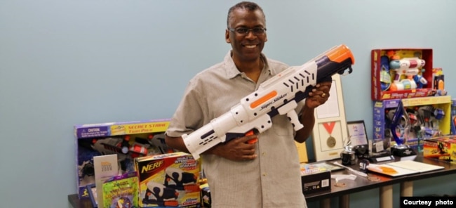 Lonnie Johnson carries the Super Soaker water gun toy, which he invented. (Courtesy of Johnson Research & Development Co., Inc)