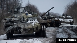 Destroyed Russian tanks are seen amid Russia's invasion of Ukraine, in the Sumy region, Ukraine, March 7, 2022. (Press Service of the Ukrainian Ground Forces/Handout via Reuters)