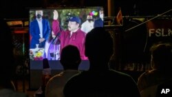 La toma de posesión del presidente Daniel Ortega vista a través de una pantalla en Nicaragua, el 10 de enero de 2022.