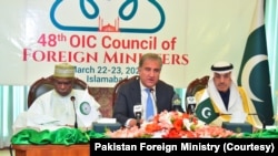 OIC Secretary-General Hissein Brahim Taha (left), Pakistan Foreign Minister Shah Mehmood Qureshi (center), and Islamic Development Bank's president,Muhammad Sulaiman Al-Jasser, at press conference in Islamabad, March 21, 2022.
