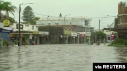 A view shows a flooded street following heavy rains in the town of Byron Bay, New South Wales, Australia, March 30, 2022 in this still image taken from a video. (Australian Broadcasting Corporation/Handout via Reuters) 
