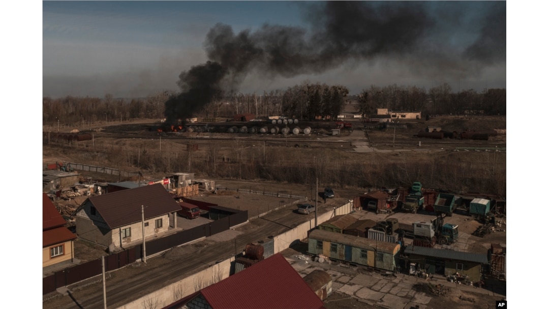 Smoke billows from burning containers after shelling in Vasylkiv, south west of Kyiv, Ukraine, March 12, 2022.