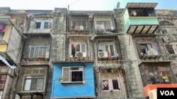 Under a redevelopment project, high rise buildings will replace these dilapidated century-old tenements called BDD Chawls in the heart of Mumbai and give the residents 500 square foot apartments in exchange. (Anjana Pasricha/VOA)