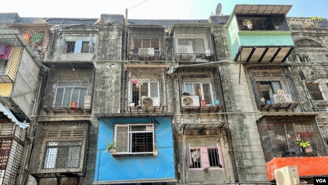 Under a redevelopment project, high rise buildings will replace these damaged, century-old tenements called BDD Chawls in the heart of Mumbai and give the residents new, larger homes. (Anjana Pasricha/VOA)