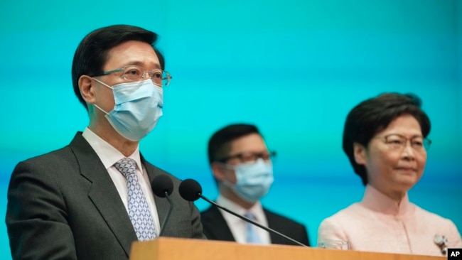 This file photo shows, from right, Hong Kong's Chief Executive Carrie Lam, Secretary for Security Chris Tang and Chief Secretary John Lee attend a news conference in Hong Kong, on June 25, 2021. (AP Photo/Kin Cheung, File)