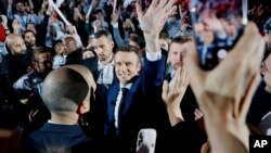 French President Emmanuel Macron, who is campaigning for reelection, arrives for a meeting in Paris, April 2, 2022. France's first round of the presidential election will take place April 10.