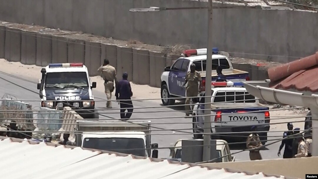 Police officers work in Mogadishu, Somalia, March 23, 2022, in this still image obtained from a social media video. (Twitter/@Hajishire/via Reuters)