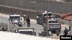 FILE - Police officers work in Mogadishu, Somalia, March 23, 2022, in this still image obtained from a social media video. (Twitter/@Hajishire/via Reuters)