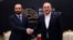 In this photo provided by Turkish Foreign Ministry, Armenia's Foreign Minister Ararat Mirzoyan, left, shakes hands with his Turkish counterpart Mevlut Cavusoglu during a meeting in Antalya, Turkey, March 12, 2022.