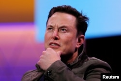 FILE - FILE PHOTO: SpaceX owner and Tesla CEO Elon Musk gestures during a conversation with legendary game designer Todd Howard (not pictured) at the E3 gaming convention in Los Angeles, California, June 13, 2019.