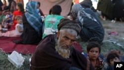 FILE- Internally displaced Afghans from northern provinces, who fled their home due to fighting between the Taliban and Afghan security personnel, take refuge in a public park in Kabul, Afghanistan, Aug. 9, 2021. 