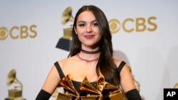 Olivia Rodrigo, winner of the awards for best pop vocal album for "Sour," best new artist and best pop solo performance for "drivers license," poses in the press room at the 64th Annual Grammy Awards at the MGM Grand Garden Arena on Sunday, April 3, 2022,