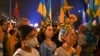 FILE - Members of the Ukrainian Australian community and supporters participate in a protest against Russia’s invasion of Ukraine, at the Sydney Opera House, in Sydney, March 1, 2022. 