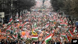 FILE - Thousands of supporters of Hungary's Prime Minister Viktor Orban gather in Budapest, Hungary, for a "peace march" ahead of national elections, March 15, 2022.