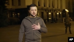  In this image from video provided by the Ukrainian Presidential Press Office, Ukrainian President Volodymyr Zelenskyy speaks from Kyiv, Ukraine, early March 24, 2022. 
