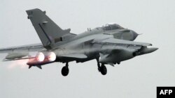 FILE - A Tornado GR4 Strike aircraft departs from its home base at RAF Marham, Norfolk, UK, 10 Feb. 2003.