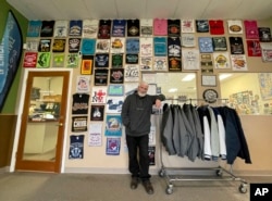 Wayne Holly, the owner of Rio Rancho T-Shirts, poses for a portrait at the family-owned shop in Rio Rancho, New Mexico., March 21, 2022.