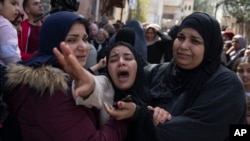 Palestinian Hadeel Abu Atiyeh, cries during the funeral of her brother Sanad Abu Atiyeh, 17, in the West Bank refugee camp of Jenin, Jenin, March 31, 2022