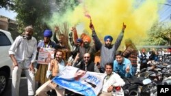 Aam Aadmi Party workers celebrate as early trends indicate victory for the party in Punjab state elections in Amritsar, India, March 10, 2022.