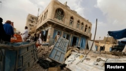 FILE- A house damaged during fighting between Houthis against army forces is seen in Yemen's northwestern city of Amran, July 14, 2014. Yemen's president has demanded the withdrawal of the Shi'ite Muslim tribesmen from the provincial city of Amran.