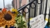 Yellow and blue ribbons, the national colors of Ukraine, adorn the iron railing outside the front door of the Ukraine Embassy, Washington, D.C., March 9, 2022. (Carolyn Presutti/VOA) 