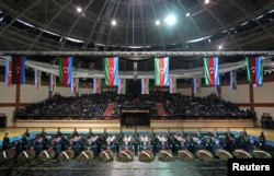 FILE - Coffins of servicemen killed in the crash of an Azerbaijani military helicopter on Nov. 30, 2021, are seen during a funeral service in Baku, Azerbaijan, Dec. 1, 2021.