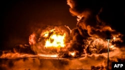 Smoke and flames rise from a Saudi Aramco oil facility in Saudi Arabia's Red Sea coastal city of Jeddah, on March 25, 2022, following a reported Yemeni rebels attack. 